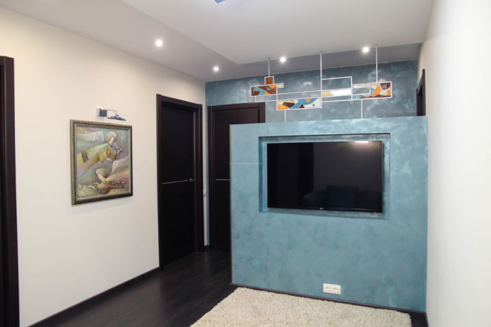 TV in a niche in the partition in the interior