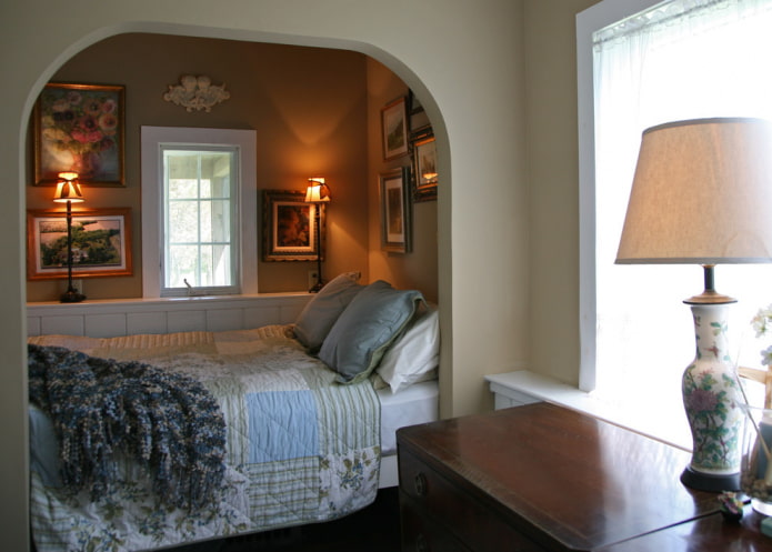 niche with a bed by the window in the interior niche with a bed by the window in the interior