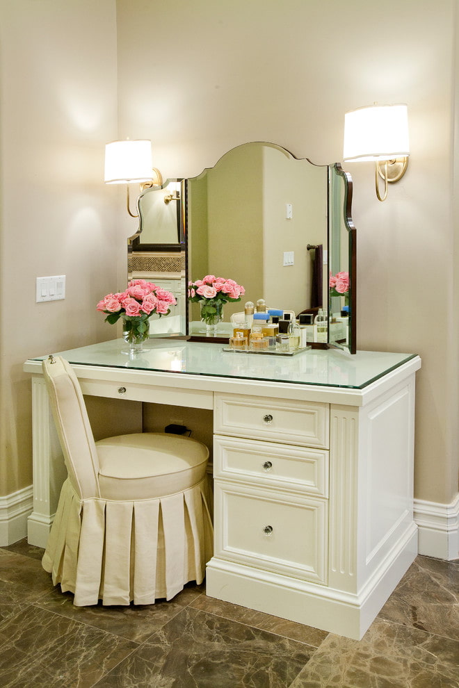 makeup table with sconces in the interior makeup table with sconces in the interior