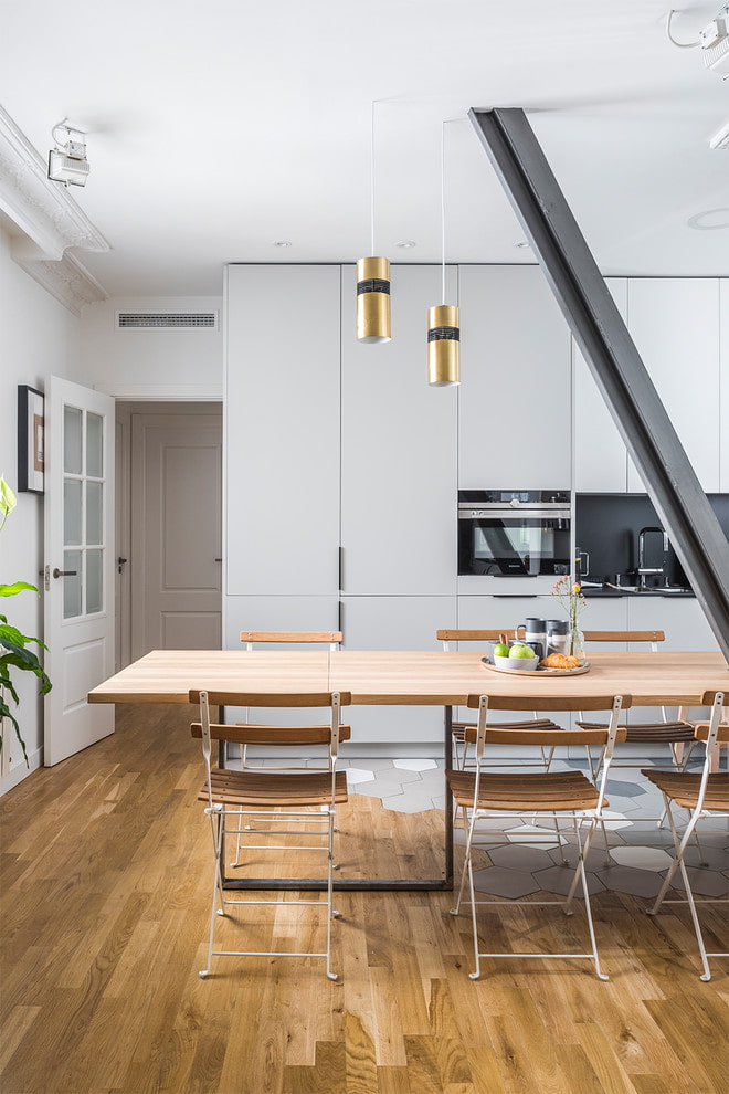 Natural wood dining table in the kitchen Natural wood dining table in the kitchen