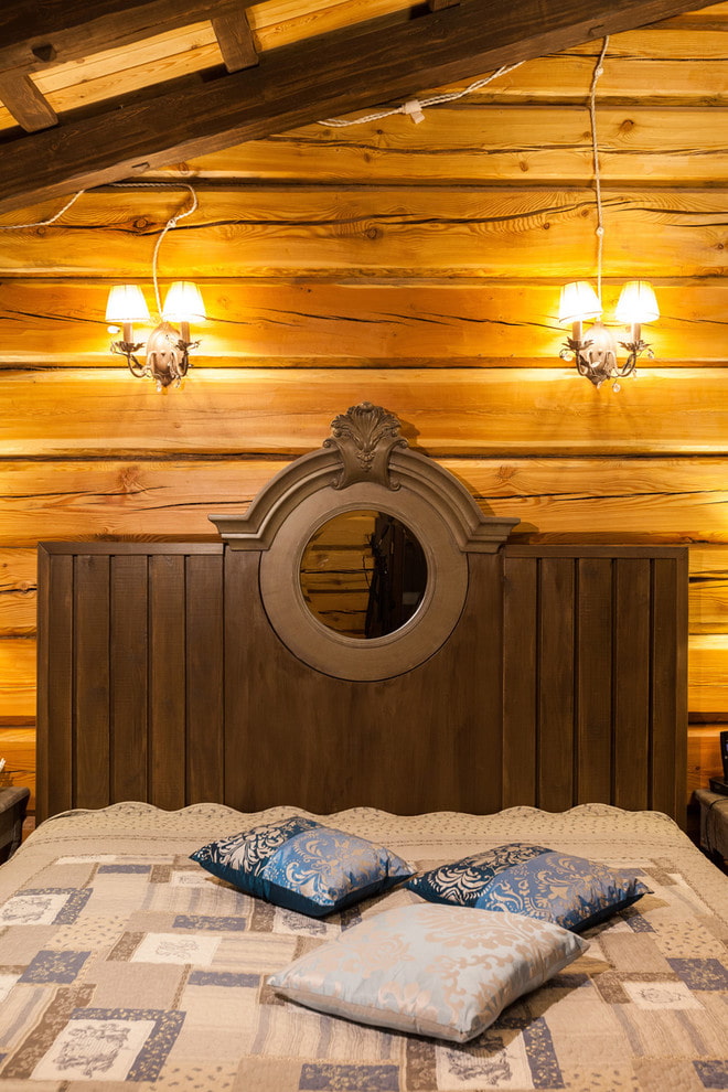 wooden bed with carved headboards in the interior wooden bed with carved headboards in the interior