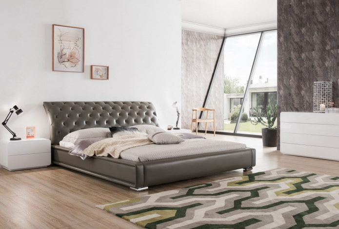 bed with a curved headboard in the interior bed with a curved headboard in the interior