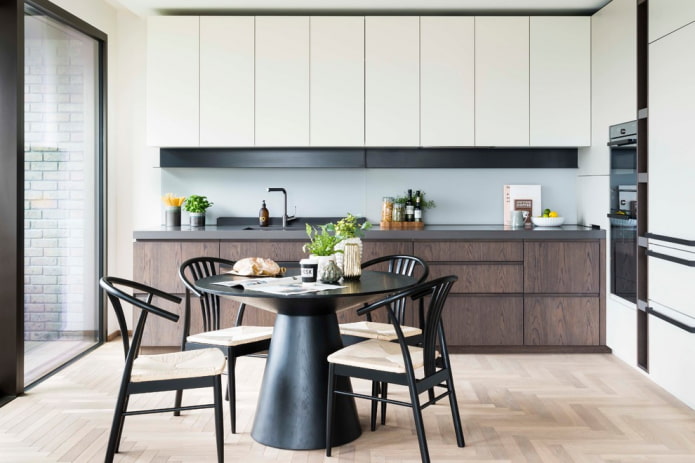 round black table in the interior of the kitchen round black table in the interior of the kitchen