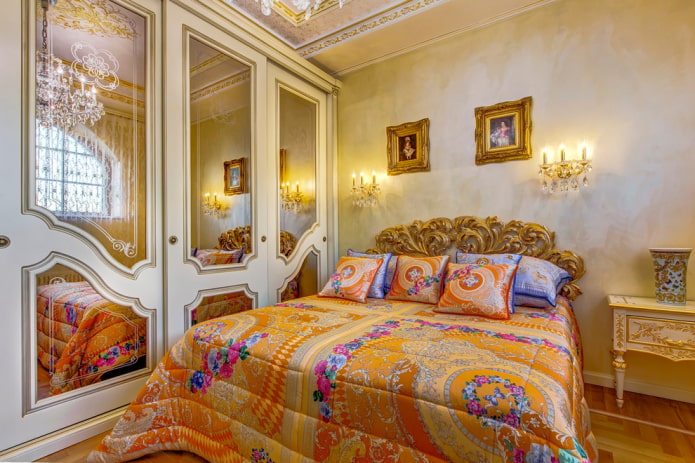 bed with a bedspread with flowers in the bedroom