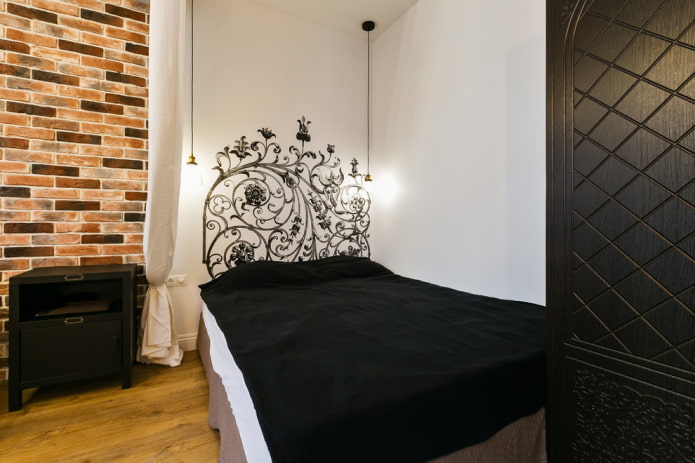 bed with a bedspread in the loft style