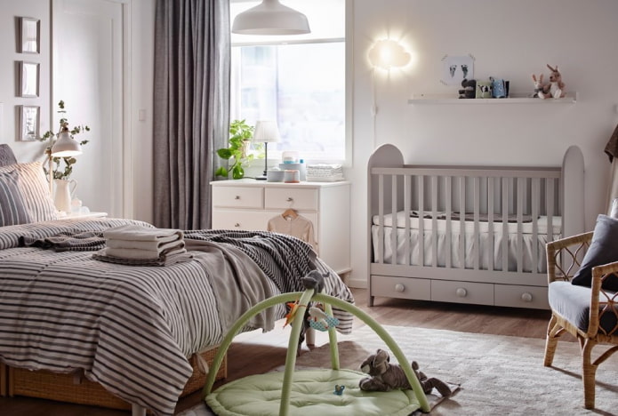 baby cot in the interior of the bedroom
