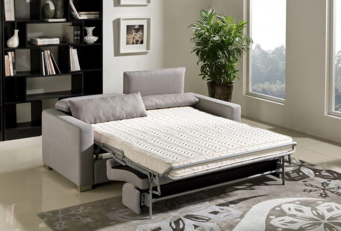 folding sofa in the interior of the living room folding sofa in the interior of the living room