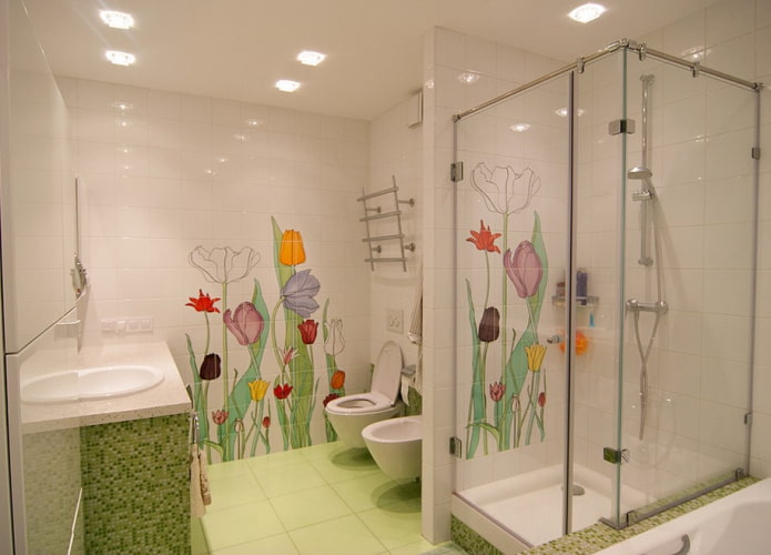 white tiles with drawings in the bathroom interior