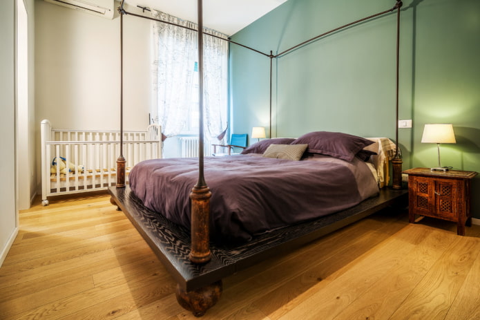 baby cot in the interior of the bedroom