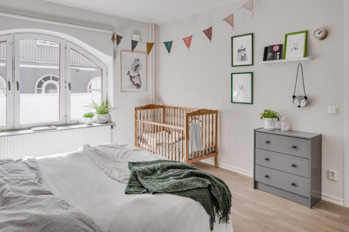 baby cot in the interior of the bedroom