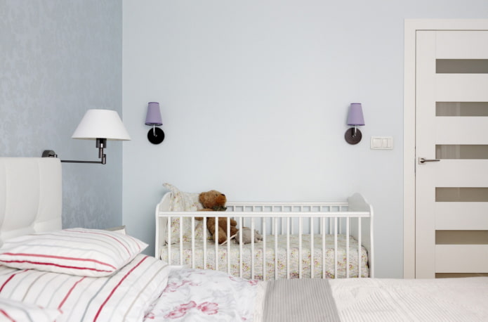 baby cot in the interior of the bedroom