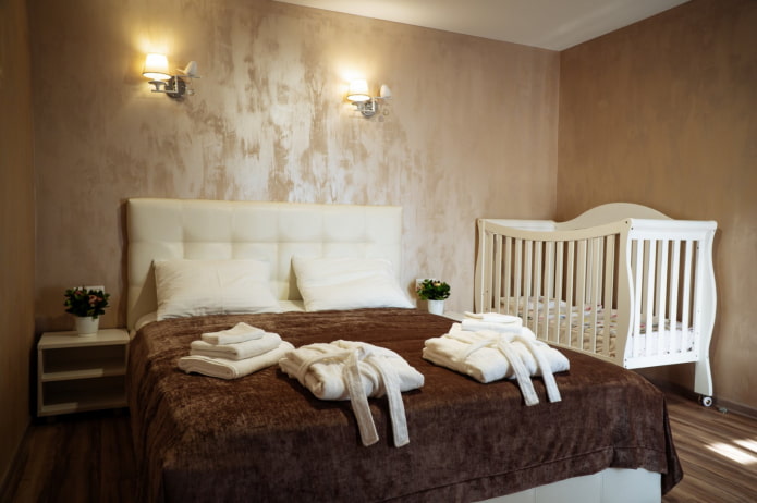 baby cot in the interior of the bedroom