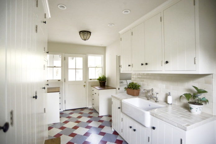 White kitchen with colored floor White kitchen with colored floor