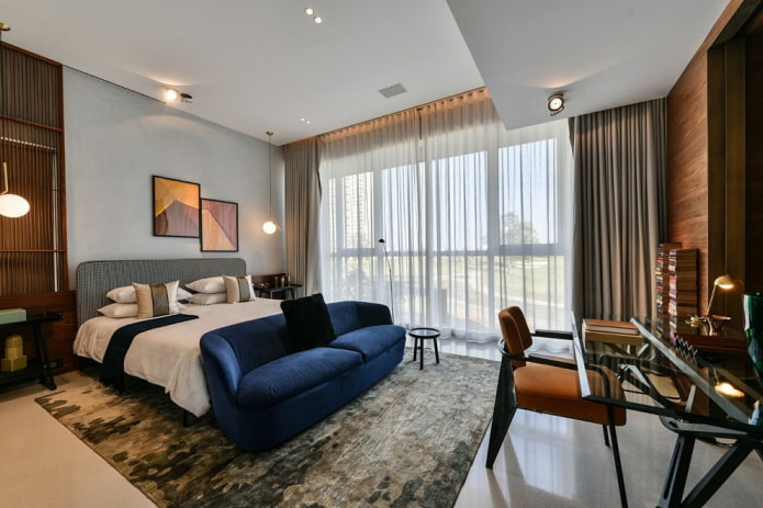 blue sofa in the interior of the bedroom