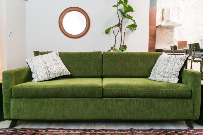 sofa with green fabric upholstery in the interior sofa with green fabric upholstery in the interior