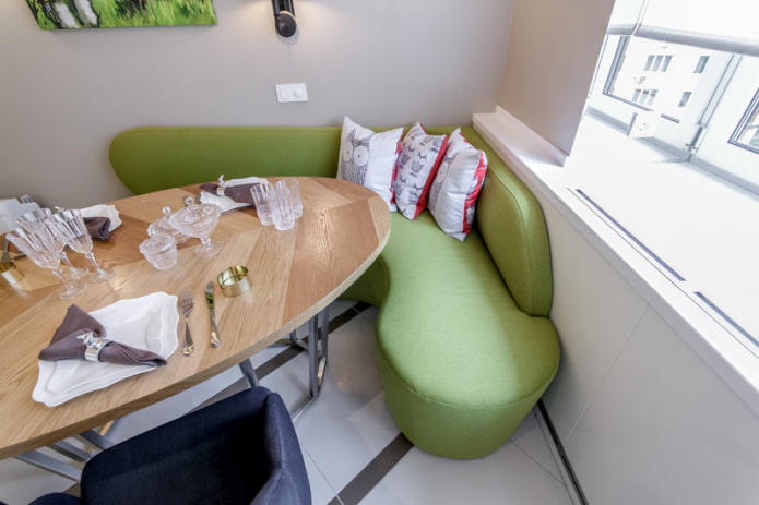 green sofa in the interior of the kitchen green sofa in the interior of the kitchen