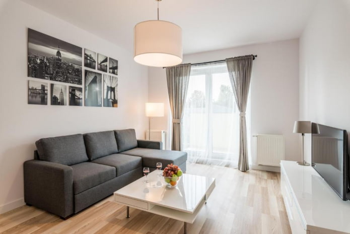 sofa model with an ottoman in the interior of the hall sofa model with an ottoman in the interior of the hall