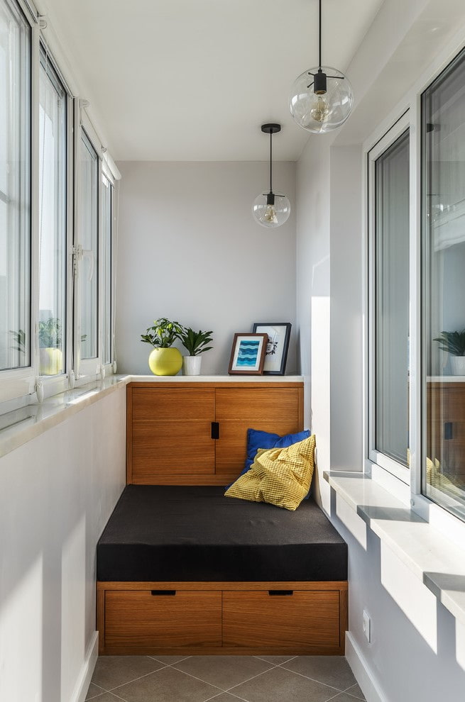 sofa with storage boxes on the loggia
