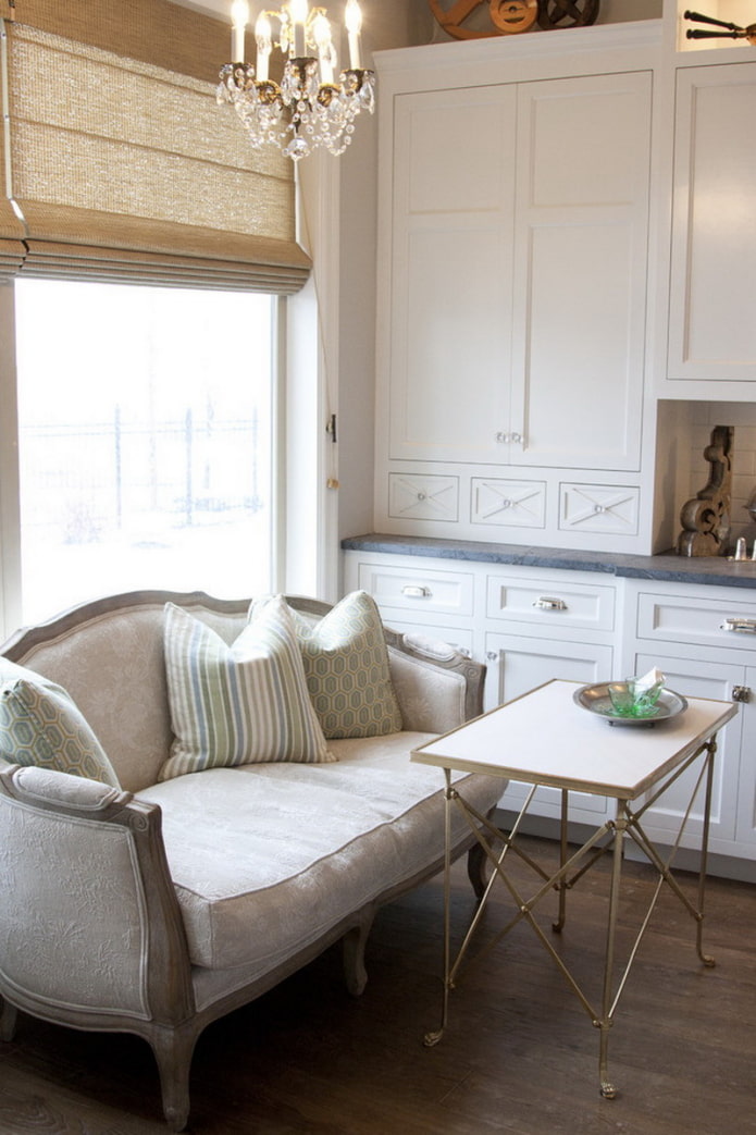 sofa on legs in the interior of the kitchen