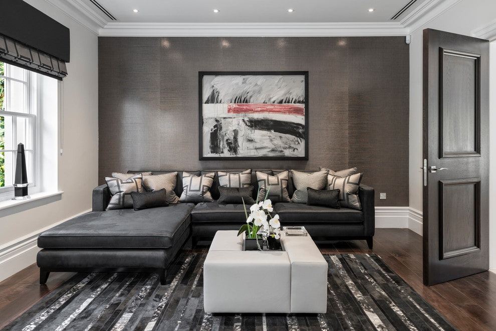 Black sofa on dark background Black sofa on dark background