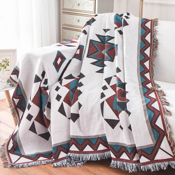 sofa cape with fringe in the interior