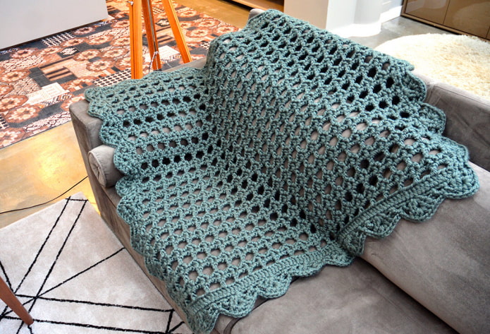knitted cover for the sofa in the interior