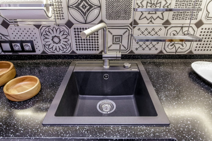 black sink made of artificial stone in the interior black sink made of artificial stone in the interior