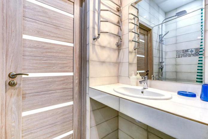 tiles around the door in the bathroom interior