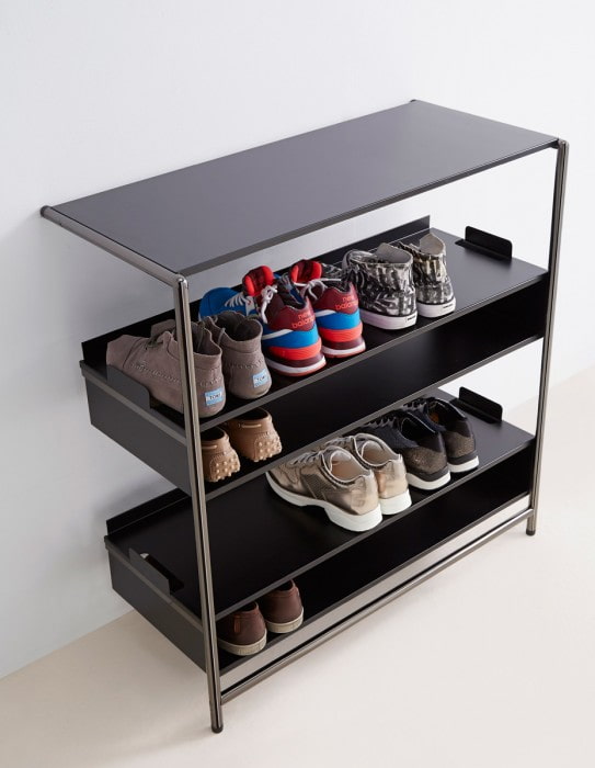 black shoe rack in the interior of the hallway