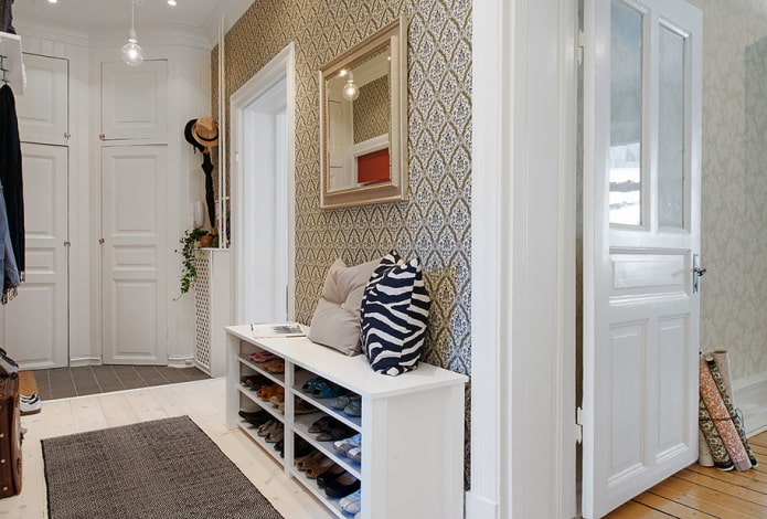 shoe rack made of chipboard in the interior of the hallway