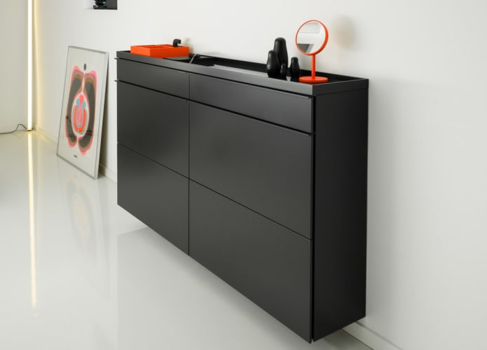 narrow shoe rack in the interior of the hallway