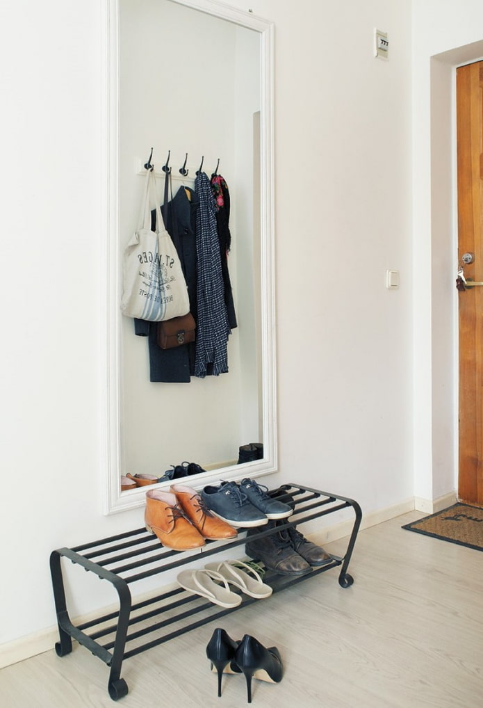 metal shoe rack in the interior of the hallway