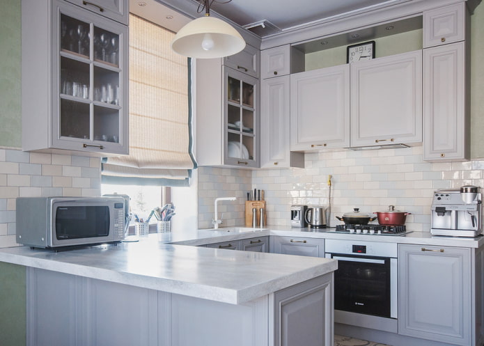 cabinets near the window in the interior of the kitchen cabinets near the window in the interior of the kitchen