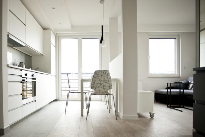 interior of a studio apartment with two windows