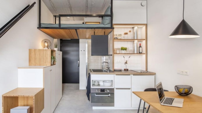 studio with a bed on the second floor