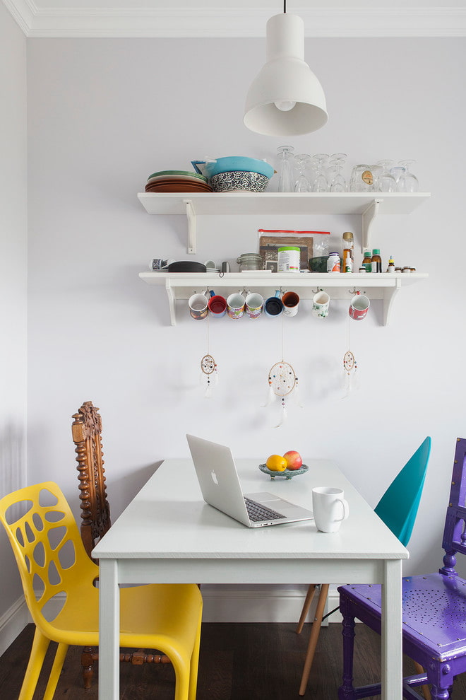 shelves above the table in the interior of the kitchen