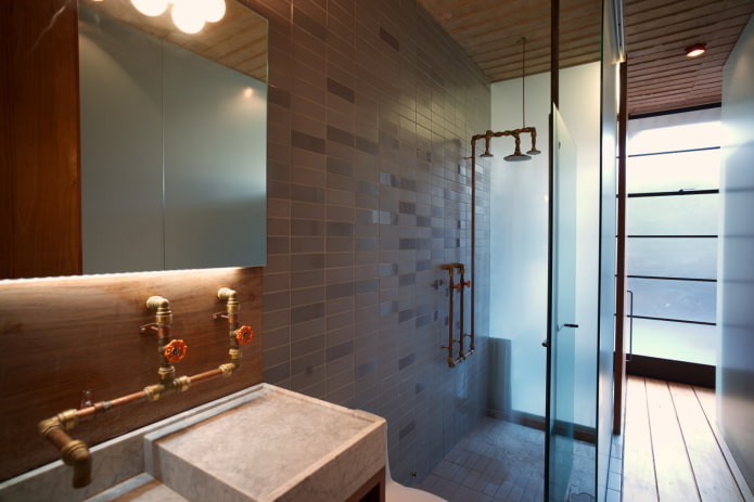 plumbing in the bathroom in the loft style