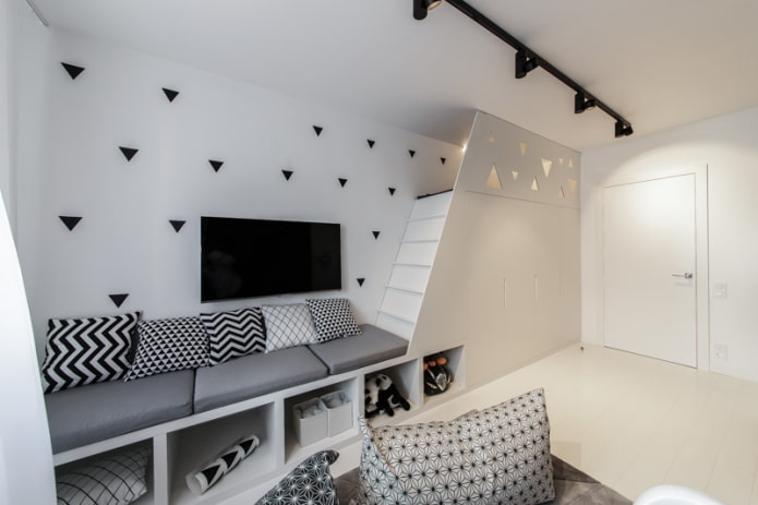 sofa with black and white ornament on pillows