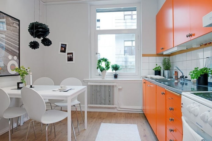 kitchen interior in orange and white tones kitchen interior in orange and white tones