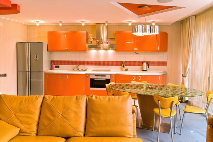 interior design of the kitchen-living room in orange colors interior design of the kitchen-living room in orange colors