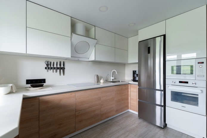 refrigerator next to the sink in the interior of the kitchen refrigerator next to the sink in the interior of the kitchen
