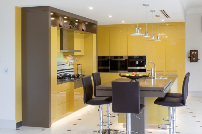 furniture and appliances in the interior of the kitchen in yellow tones furniture and appliances in the interior of the kitchen in yellow tones