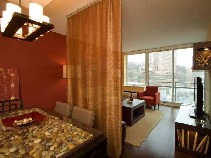 zoning with curtains in the interior of the kitchen-living room