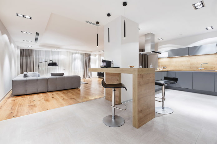 zoning with finishing materials in the interior of the kitchen-living room