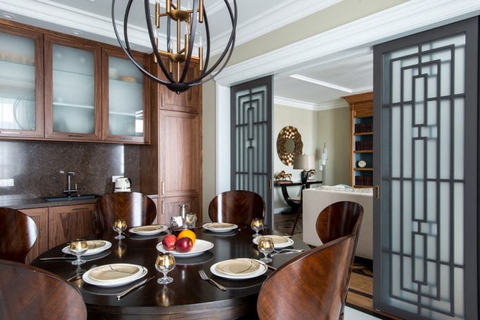 zoning with sliding doors in the interior of the kitchen-living room