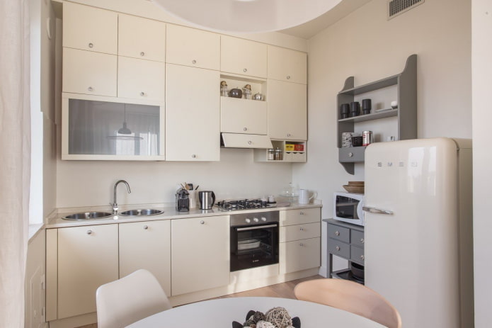furniture and appliances in the interior of the kitchen in beige tones furniture and appliances in the interior of the kitchen in beige tones
