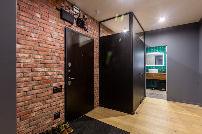 hallway with a brick wall in an industrial style