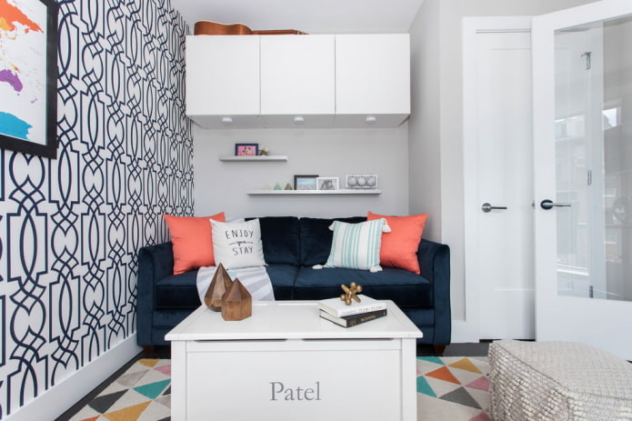 one of the walls is covered with wallpaper with an ornament