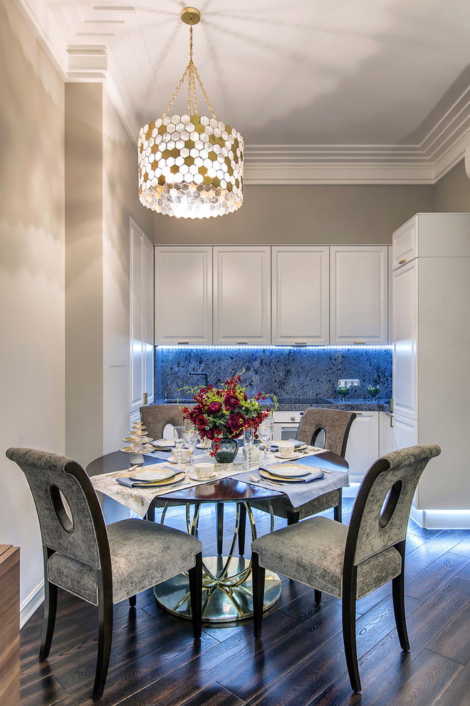 chandelier over the dining table in the kitchen