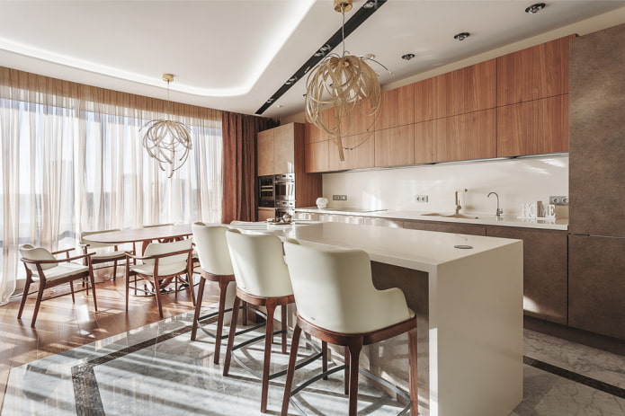 two chandeliers on the ceiling in the interior of the kitchen